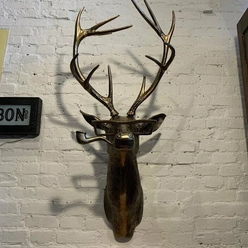 Sculpture murale avec tête d'animal avec lunettes